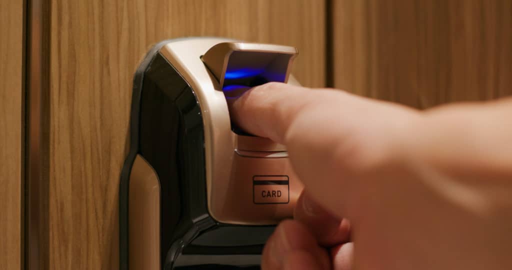 Man Use Of Fingerprint Door Lock